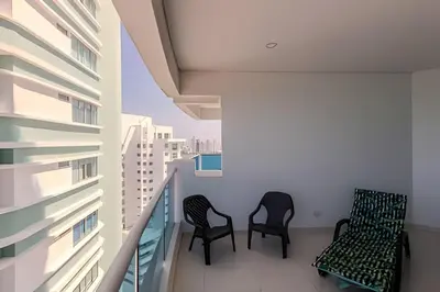two chairs on the balcony of a building at Espectacular Vista Al Mar - Ed. Infinito 2302 in Cartagena de Indias