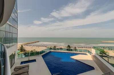 a view of the pool and beach from a building at Espectacular Vista Al Mar - Ed. Infinito 2302 in Cartagena de Indias