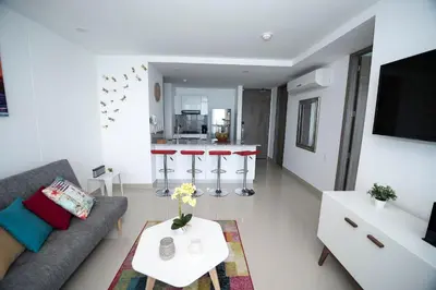 a living room with a couch and a table at Espectacular Apto 1 Hab en Bocagrande - 2504 in Cartagena de Indias