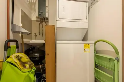 a kitchen with a refrigerator and a green bag at Infinitum - Spectacular sea view 25th floor apt in Cartagena de Indias