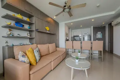 a living room with a couch and a table at Piso 27 - Espectacular apartamento en Bocagrande in Cartagena de Indias