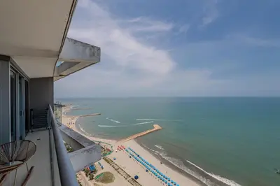a view of the beach from the balcony of a hotel at Piso 27 - Espectacular apartamento en Bocagrande in Cartagena de Indias