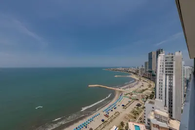 a view of a beach with buildings and the ocean at Piso 27 - Espectacular apartamento en Bocagrande in Cartagena de Indias