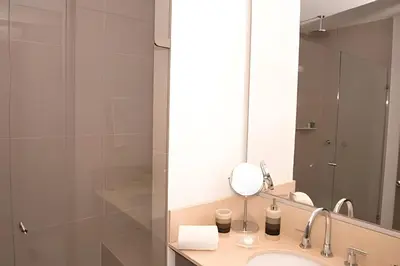 a bathroom with a sink and a mirror at Morros City - Lujoso Apto con vista al mar Piso 28 in Cartagena de Indias