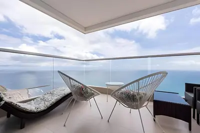 a room with a view of the ocean at Espectacular apt en el piso 29 en Palmetto Beach in Cartagena de Indias