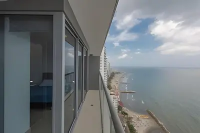 a view of the ocean from the balcony of a building at Lujoso Apto de 2 Habitaciones Piso 32- Morros City in Cartagena de Indias