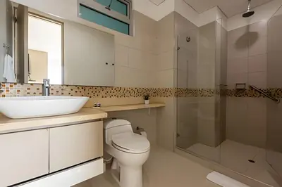 a bathroom with a toilet and a sink and a shower at Lujoso Apto de 3 Habitaciones-3303 Palmetto Beach in Cartagena de Indias