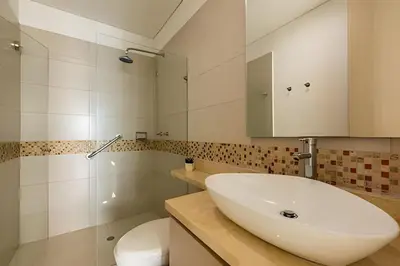 a bathroom with a sink and a toilet at Lujoso Apto de 3 Habitaciones-3303 Palmetto Beach in Cartagena de Indias