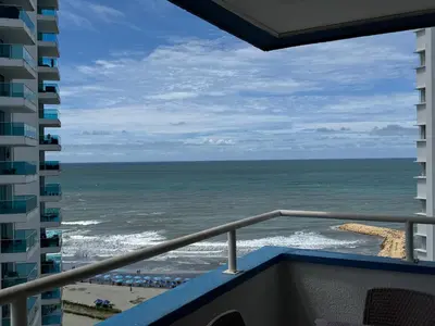 a view of the ocean from the balcony of a condo at Apartamento en Bocagrande con vista lateral al mar ICDI in Cartagena de Indias