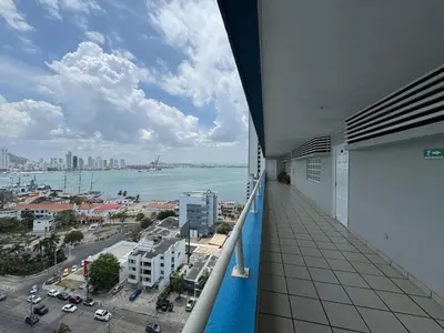 a balcony of a building with a view of the ocean at Apartamento en Bocagrande con vista lateral al mar ICDI in Cartagena de Indias