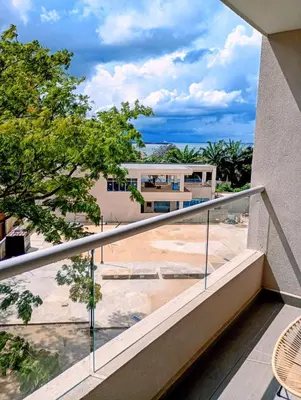 a balcony with a view of a building at Apartamento con vista al mar in Simón Bolivar