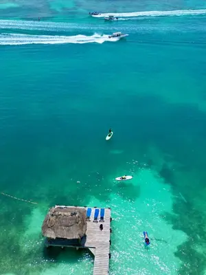 a dock in the water next to the ocean at Ecohotel Nativa Beach in Cartagena de Indias