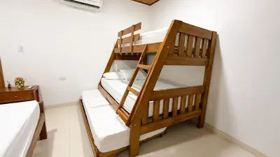 a couple of bunk beds in a room at Cabaña Datalu 3 in Coveñas