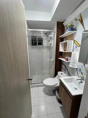 a bathroom with a shower and a toilet and a sink at Rent by days, 4th floor apartment in Cartagena de Indias