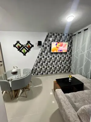 a living room with a couch and a table at Rent by days, 4th floor apartment in Cartagena de Indias