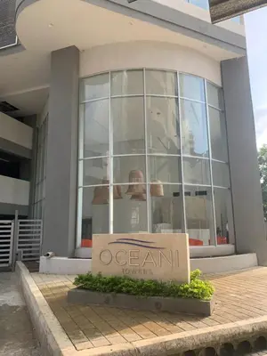 a building with a sign in front of it at Oceani Towers 1006 in Cartagena de Indias