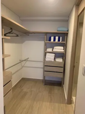 a walk in closet with towels on shelves at Oceani Towers 1006 in Cartagena de Indias