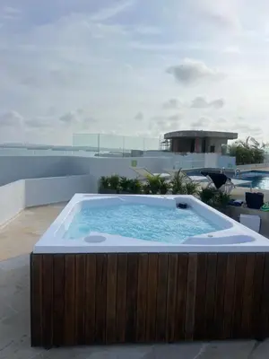 a hot tub on the roof of a house at Oceani Towers 1006 in Cartagena de Indias
