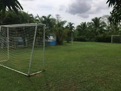 a soccer goal in a field with palm trees at Casafinca en Arjona # 3 in Cartagena de Indias