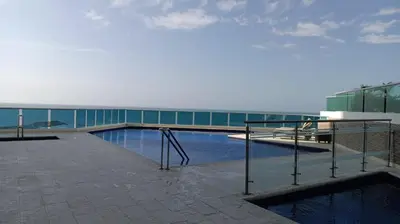 a swimming pool on the side of a building at Espectacular vista al mar - Infinito 2502 in Cartagena de Indias