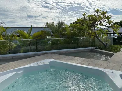 a bath tub sitting on top of a deck at Modern apt near the beach with Jacuzzi, Cartagena in Cartagena de Indias