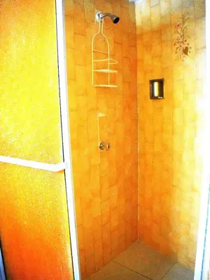 a bathroom with a shower with a ladder in it at Comfortable and quiet apartment in Cartagena de Indias