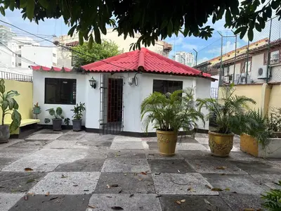 a small white house with a red roof at Comfortable and quiet apartment in Cartagena de Indias
