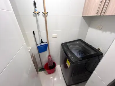 a small bathroom with a black trash can and tools at Team Renacer Broker Brisas del Mar and Pool in Cartagena de Indias