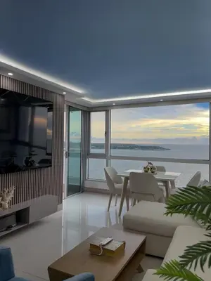 a living room with a view of the ocean at Apartamento en Palmetto sunset frente al mar piso 20 in Cartagena de Indias