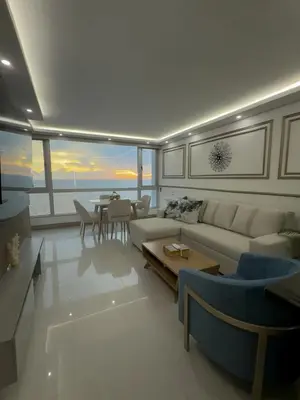 a living room with a couch and a table at Apartamento en Palmetto sunset frente al mar piso 20 in Cartagena de Indias