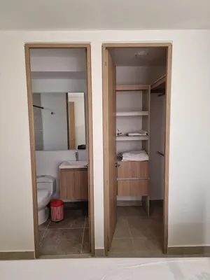 a bathroom with a toilet and a sink and a mirror at Apartamento en Cartagena, Manzanillo in La Siriaca