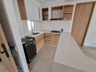 a small kitchen with white counters and a stove at Apartamento en Cartagena, Manzanillo in La Siriaca