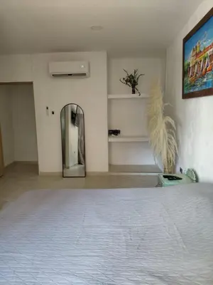 an empty room with a mirror and a wall at Oasis Colonial Cartagena in Cartagena de Indias