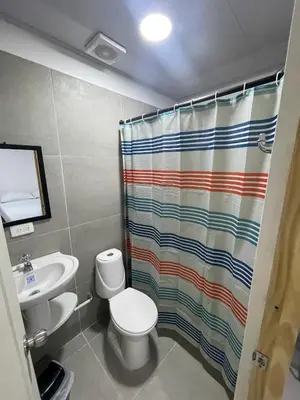 a bathroom with a toilet and a shower curtain at Calidad vs precio, wifi, cerca centro historico 3-2 in Cartagena de Indias