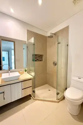 a bathroom with a shower and a toilet and a sink at by Calamari Homes - Murano Elite 1901 Bocagrande in Cartagena de Indias