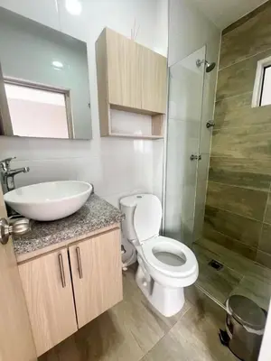 a bathroom with a toilet and a sink and a shower at Moderno apto a pasos de la playa in Cartagena de Indias