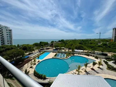 a view of a pool from a balcony of a resort at Apartamento cerca al mar santa Marta- santamarina-614 in Santa Marta