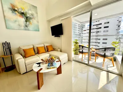 a living room with a couch and a table at Stunning Bocagrande Beach Apartment in Cartagena de Indias