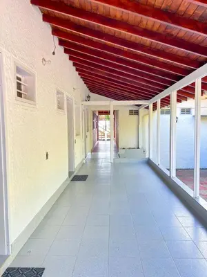 an empty hallway of a building with a red ceiling at Casa San Miguel Tolú, Playa El Francés in San Silvestre
