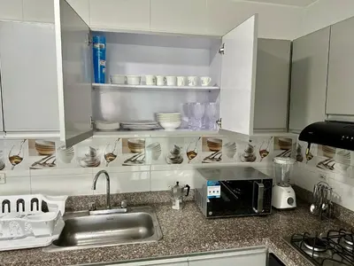 a kitchen with a sink and a counter with dishes at Dubai 202 in Barranquilla