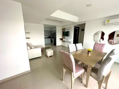a living room with a dining room table and chairs at Dubai 202 in Barranquilla
