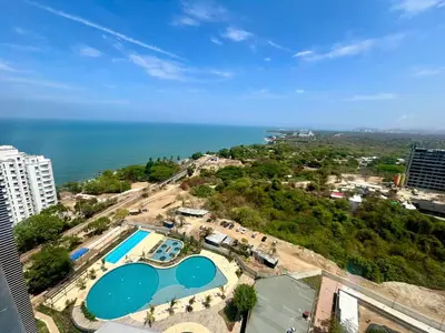 an overhead view of a swimming pool and the ocean at Apartamento de Lujo en Santa Marta con vista al mar -Santamarina- 1802 in Santa Marta