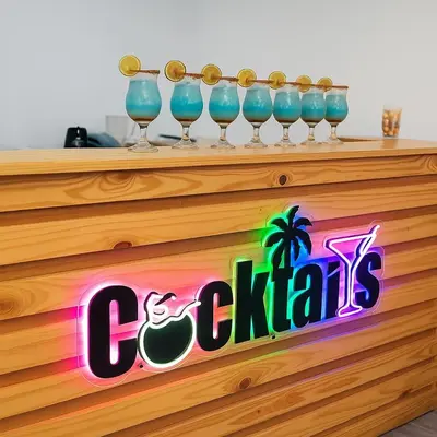 a group of glasses sitting on top of a wooden shelf at Casa Mariana Hostel Boutique in Santa Marta