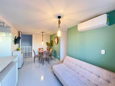 a living room with a couch and a table at Apartamento primer piso Olamar Coveñas in Coveñas