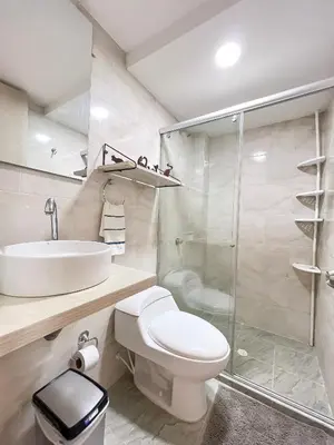 a bathroom with a toilet and a sink and a shower at Apartamento primer piso Olamar Coveñas in Coveñas