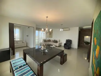 a living room with a table and a couch at Bijao 6b in Barranquilla