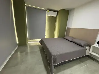 a bedroom with a bed and a window at Coral Tower 603 in Barranquilla
