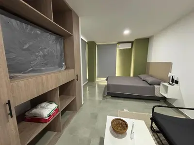a bedroom with a bed and a tv in a room at Coral Tower 603 in Barranquilla