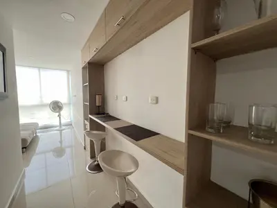 a bathroom with white walls and a stool in a room at Kairos 1209 in Barranquilla
