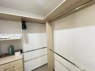 a walk in closet with a sliding door at Kairos 1209 in Barranquilla